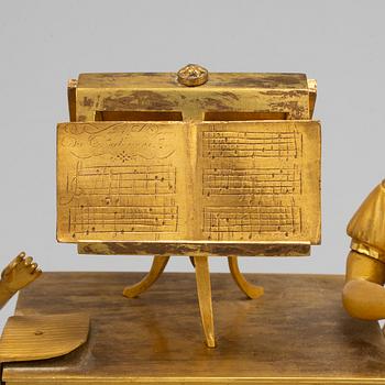 A French Empire gilt bronze mantel clock, first half of the 19th century.