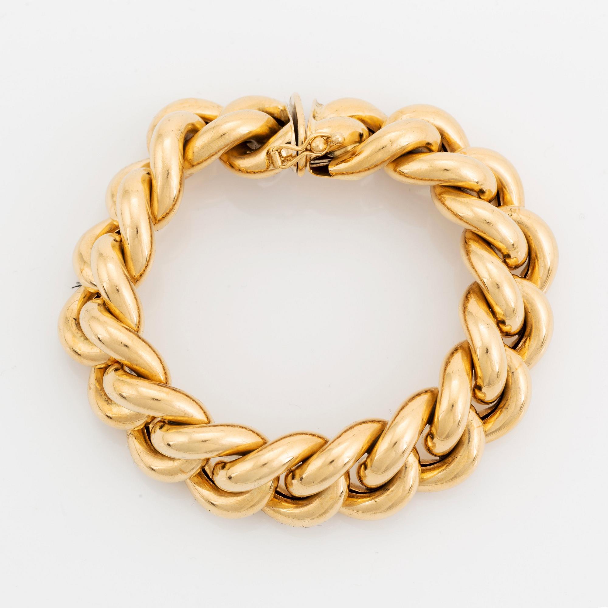 An 18K gold bracelet.