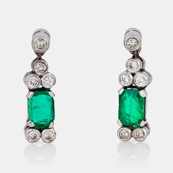 525. A pair of emerald and brilliant-cut diamond earrings.