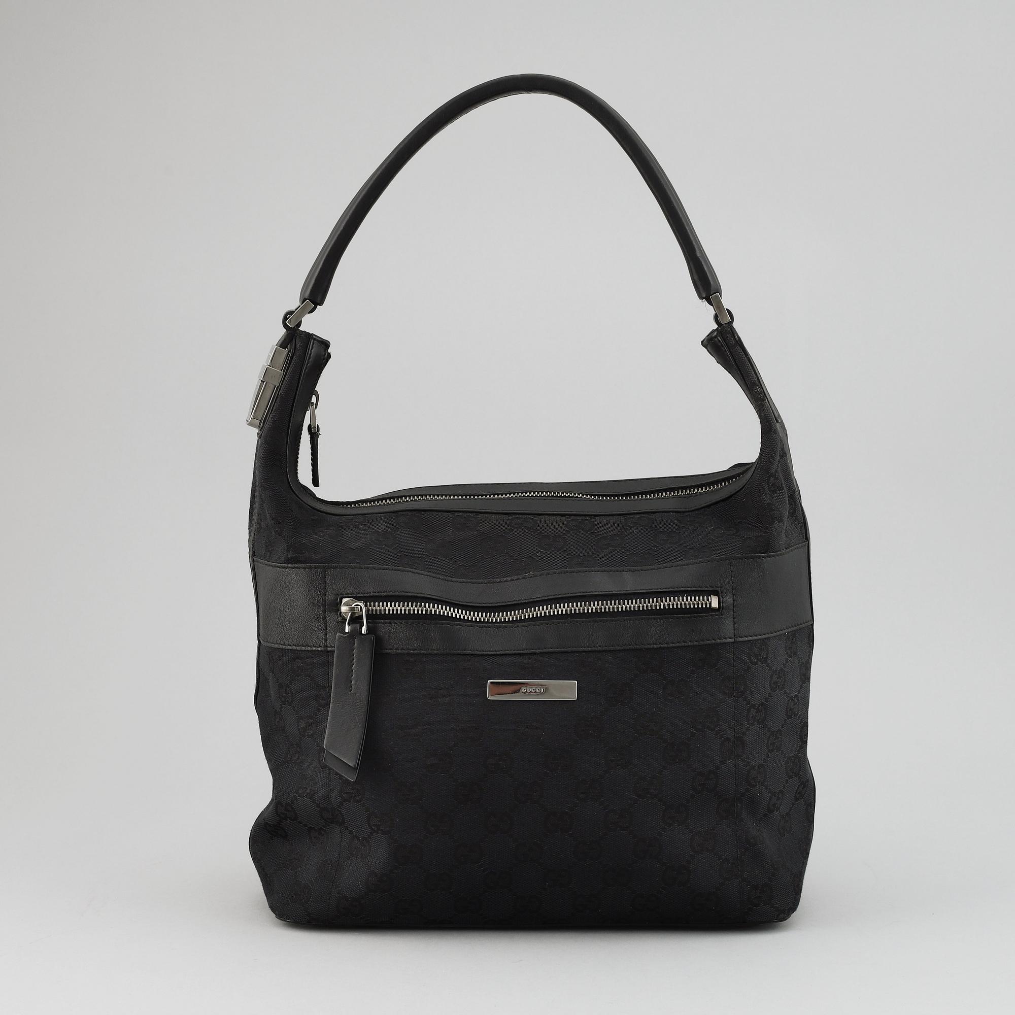 GUCCI, a canvas and leather bag.