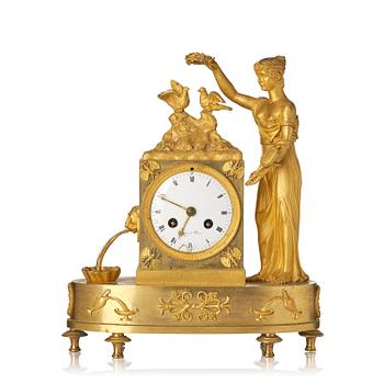 149. A French Empire figural mantel clock, early 19th century.