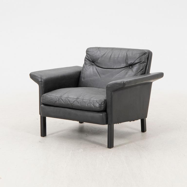 A 1960/70s Hans Olsen leather armchair.