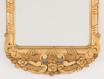 An early 20th century rococo style mirror.