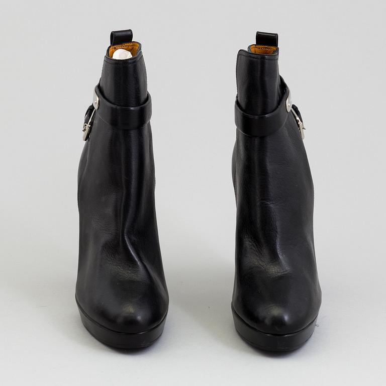 A pair of black leather bootie by Ralph Lauren.