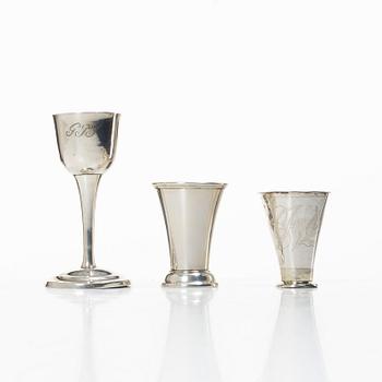 A Swedish silver cup and two beakers.