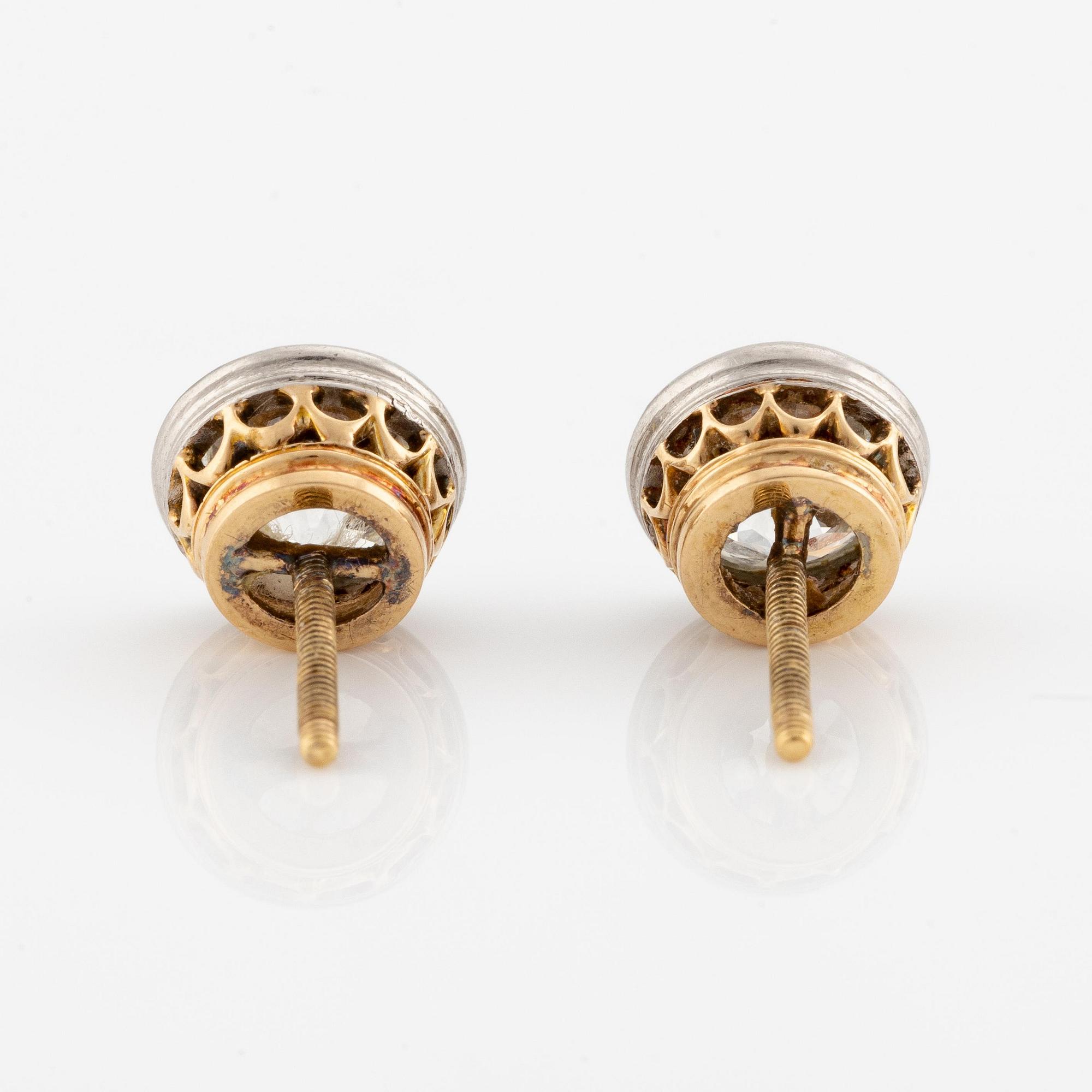 A pair of earrings in gold with old-cut diamonds.