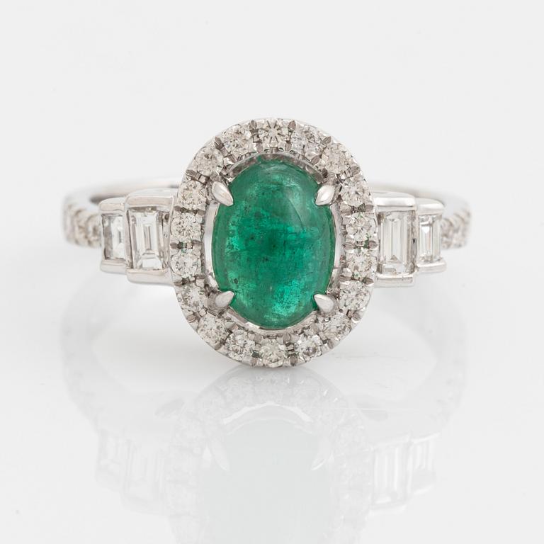 Cabochon cut emerald, baguette and brilliant cut diamond ring.