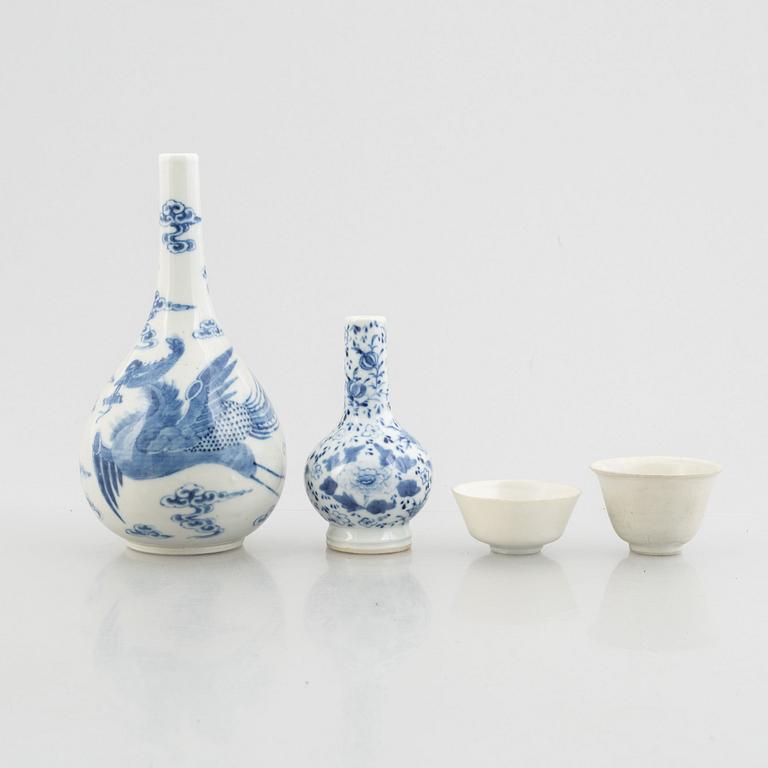 Two blue and white vases and two white glazed cups, China, late Qing dynasty and early 20th century.