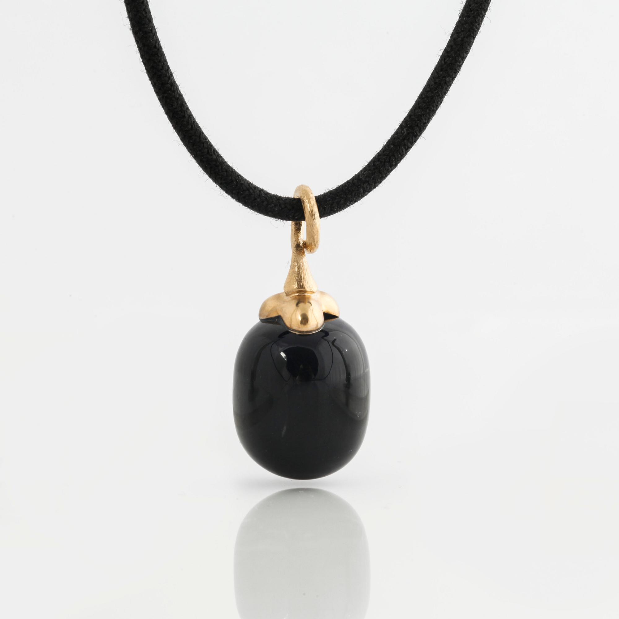 A onyx pendant by Ole Lynggaard.