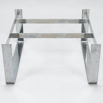 A chromed steel and polished granite coffee table, latter half of the 20th century.