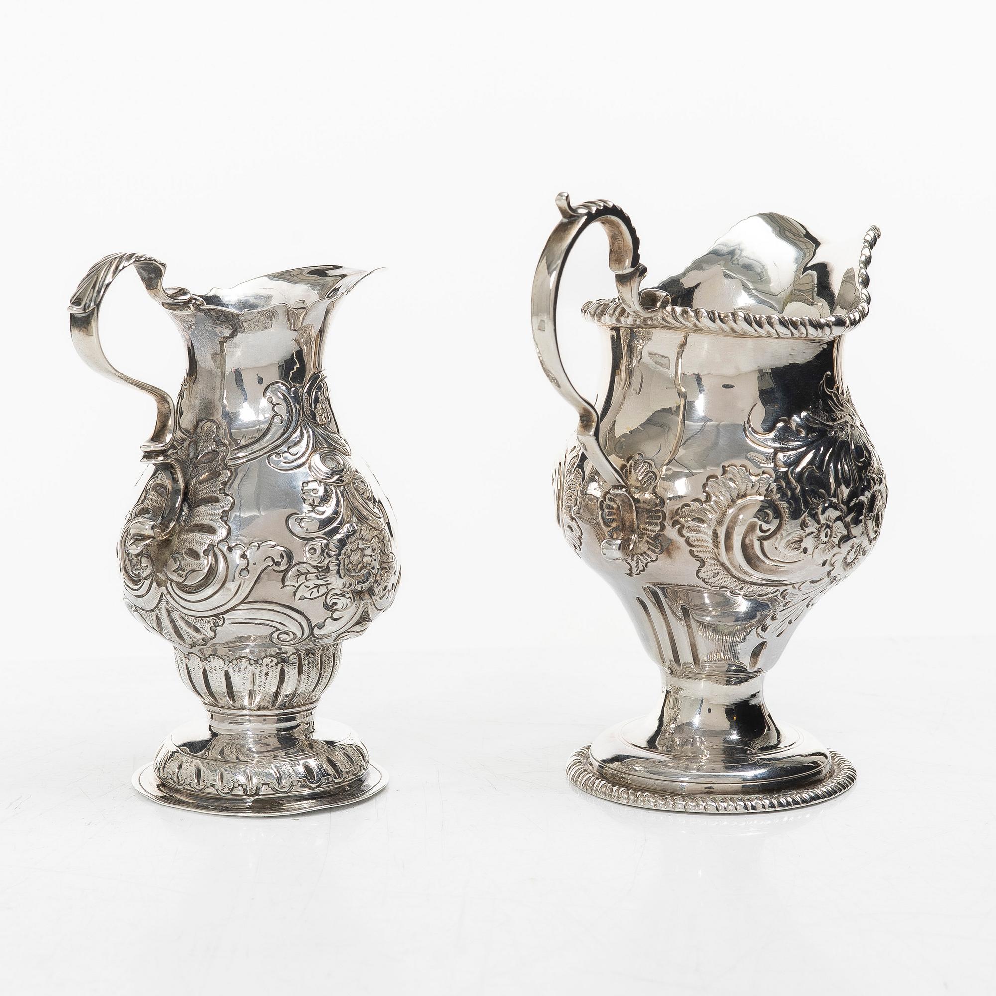 Two creamers, a tray, and a sugar tongs, silver, Rococo and Rococo style, 18th-19th century.