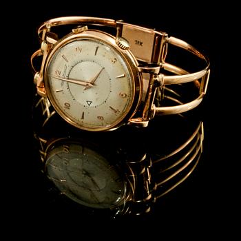ARMBANDSUR, herr, 18 k guld, Jaeger LeCoultre, "Memovox". omkring 1900-talets mitt. Total vikt 56 g.