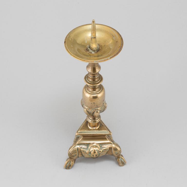 A 17th century bronze candlestick.