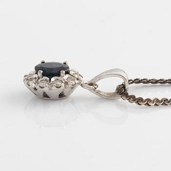 Pendant and a pair of earrings, white gold with sapphires and brilliant-cut diamonds.