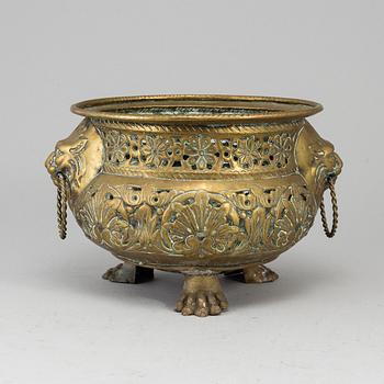 An 18th century brass flower pot.