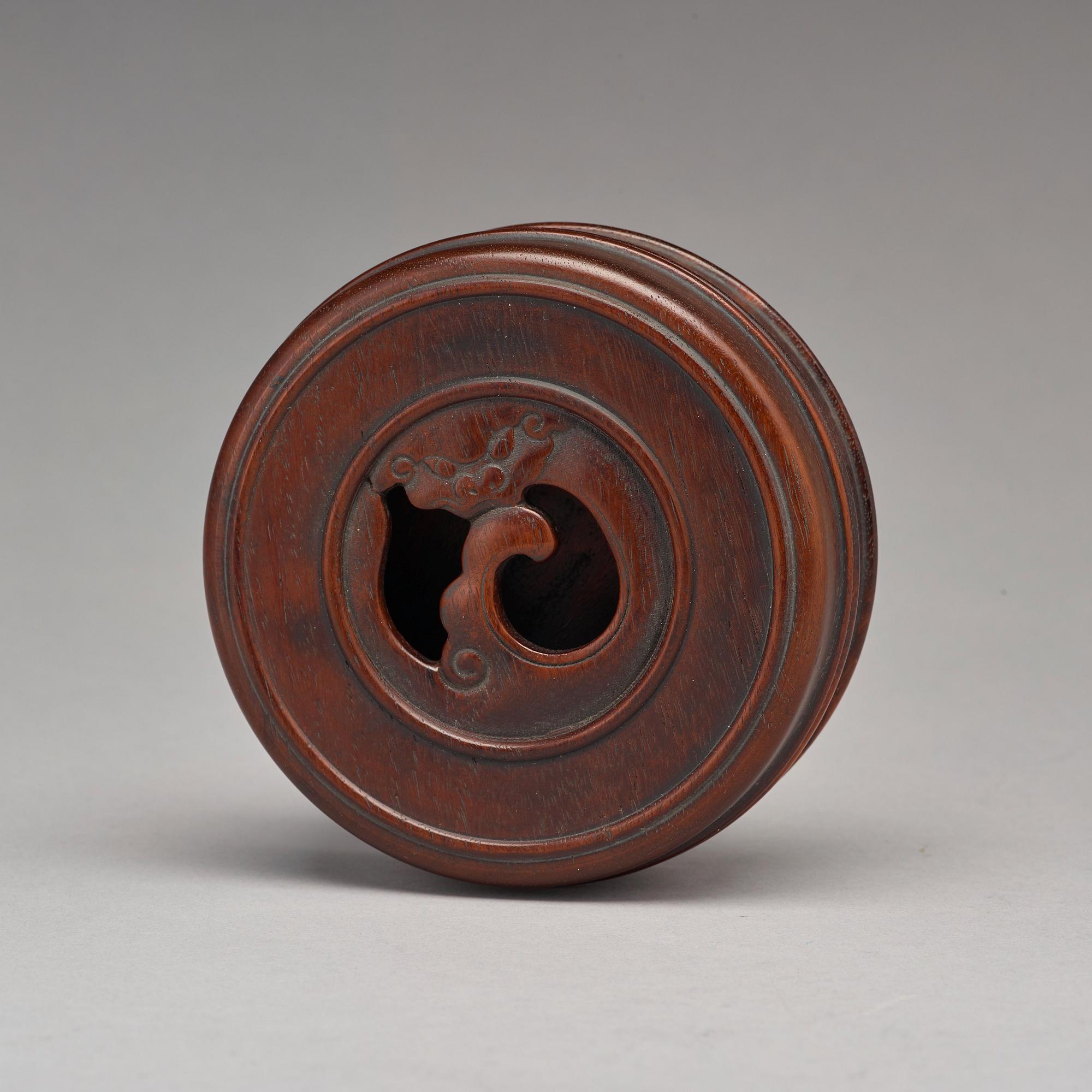 A Chinese wooden box with cover.