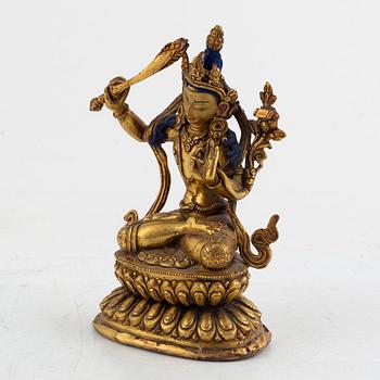 A gilt bronze figure of Manjushri, 20th century.