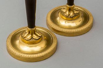 A pair of French Empire early 19th century candlesticks.