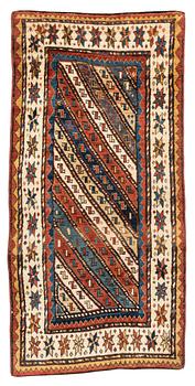 An antique Gendje rug, south Caucasus, c. 208 x 103 cm.
