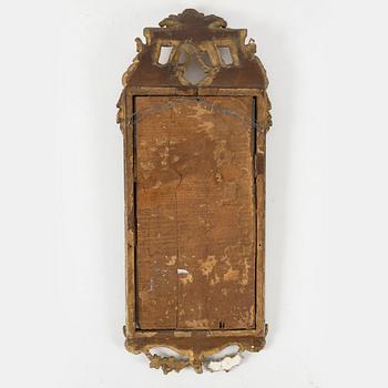 A Gustavian carved giltwood mirror, Stockholm, late 18th century.