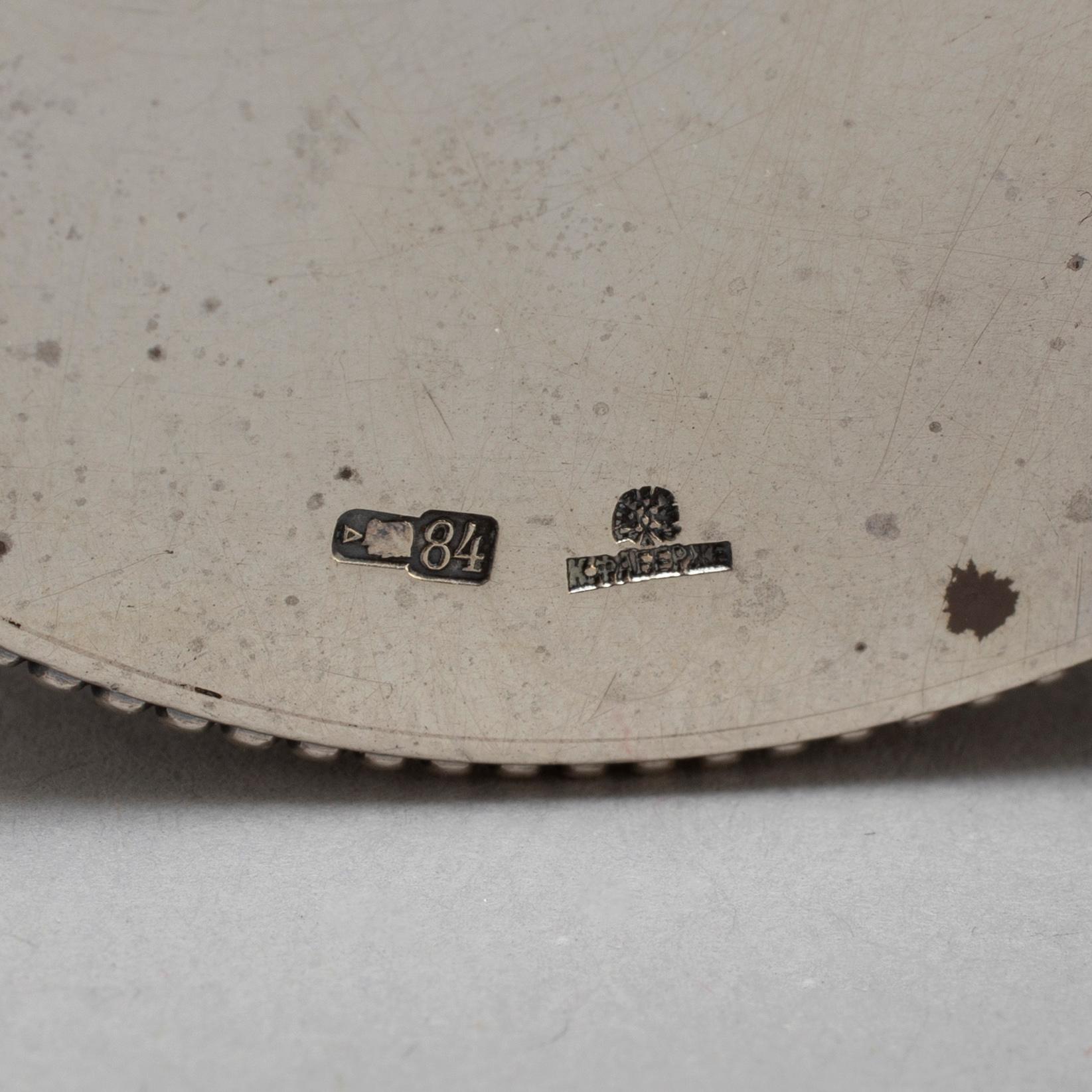 A set of four Fabergé salt-cellars and spoons, marked Moscow 1908-1917. Imperial Warrant.