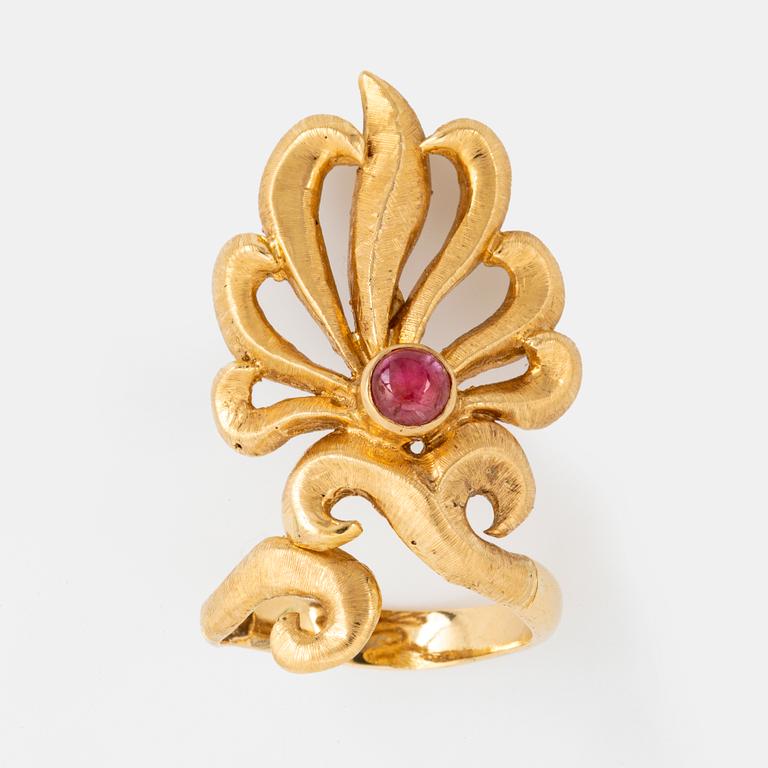 18K gold and cabochon-ruby ring.