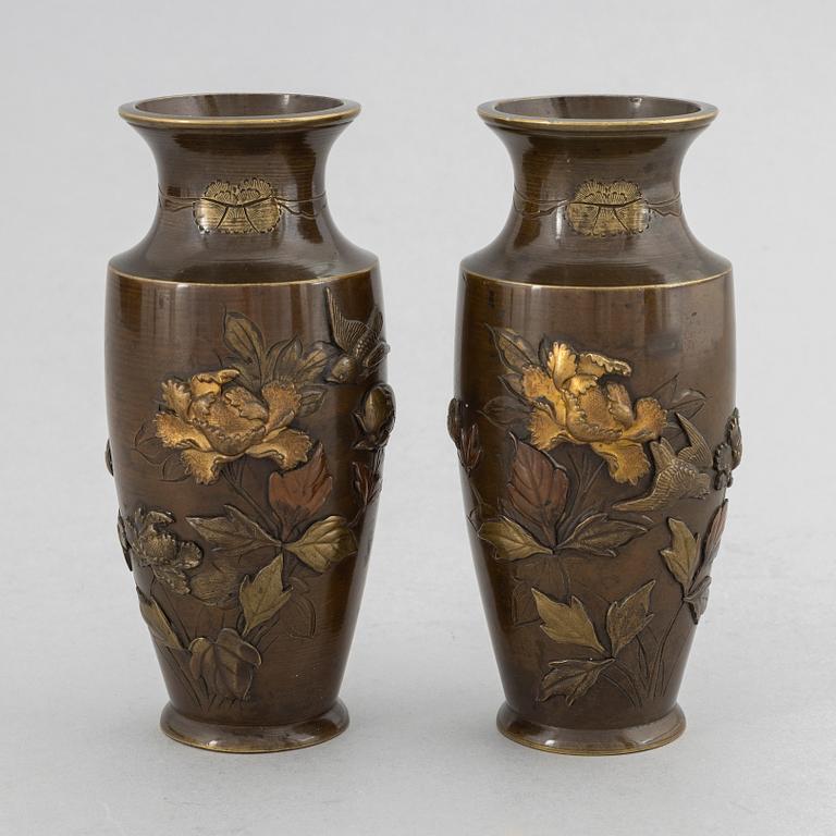 A pair of Japanese patinated bronze and mixed metal vases, Meiji period (1868-1912).