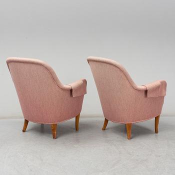 A pair of second half of the 20th Century 'Cirkus' easy chairs by Carl Malmsten.