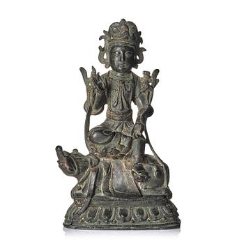 1246. A bronze figure of Boddhisattva seated on an elephant, probably late Ming dynasty.