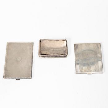 Two cigarette cases and a snuffbox, silver, Sweden and Swedish import marks respectively.