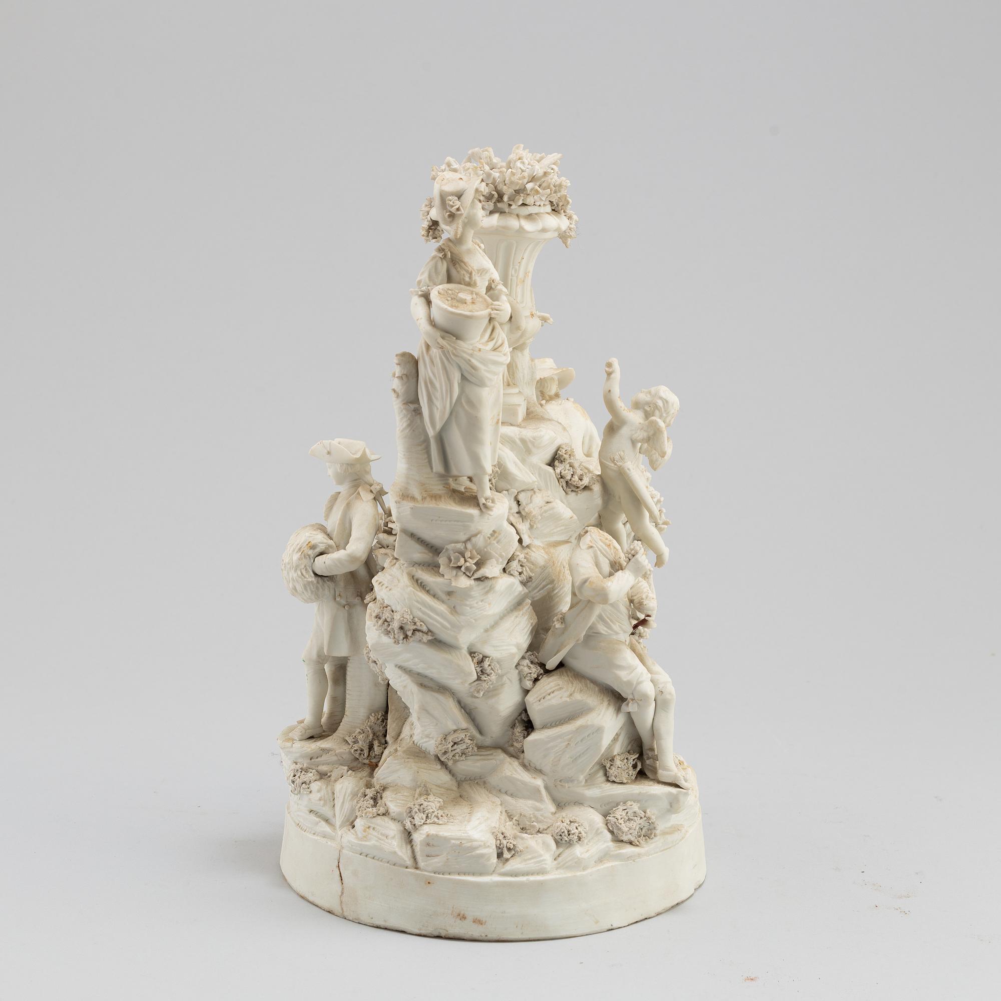 A porcelain figurine group circa 1900.