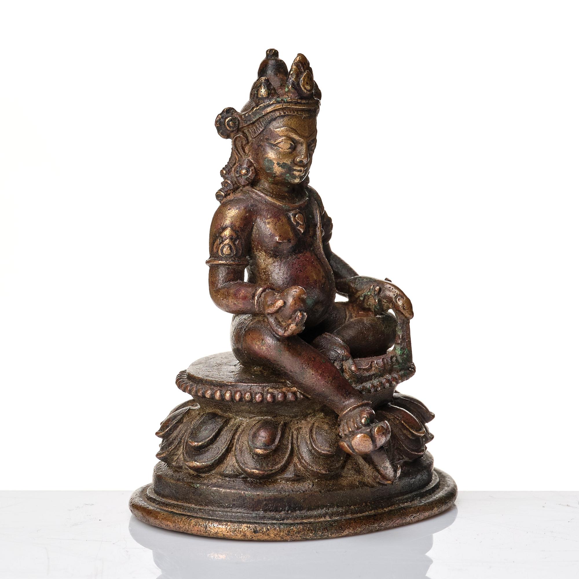 A copper alloy figure of Jambhala, Nepal, possibly 12/13th Century.