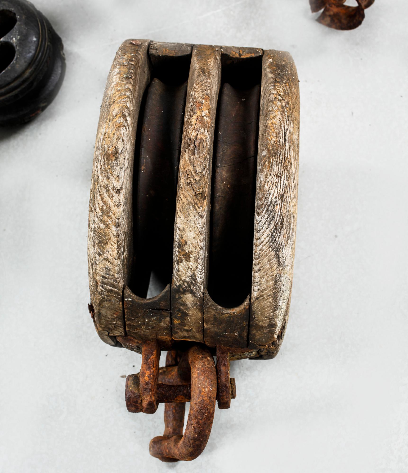 Seven pullies from the first half of the 20th century.