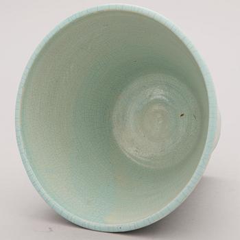 A glazed ceramic pot, signed and dated -34.