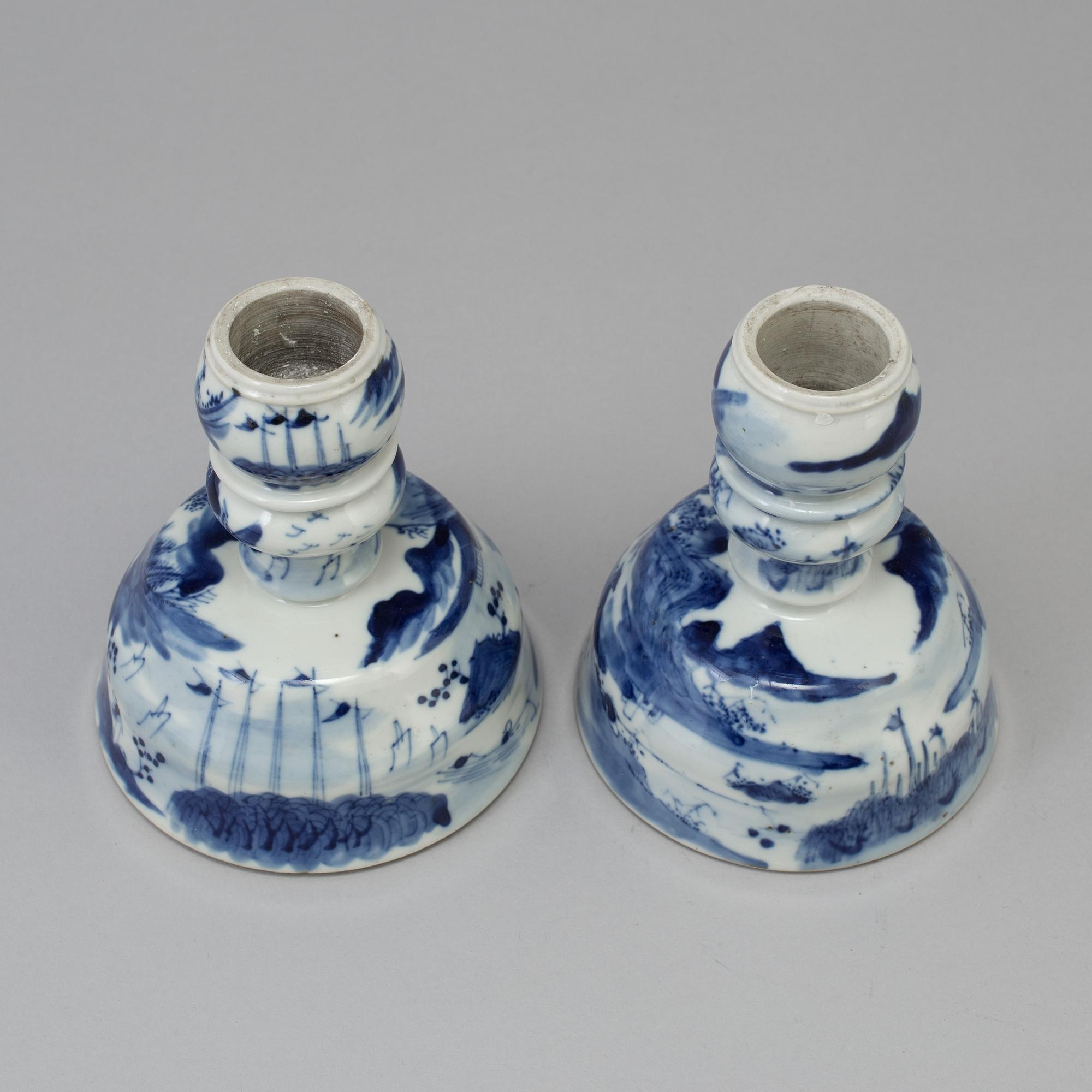 A pair of blue and white candlesticks, late Qingdynasty.