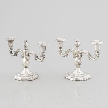 A pair of Swedish silver candelabras, marks of CG Hallberg, Stockholm 1959.