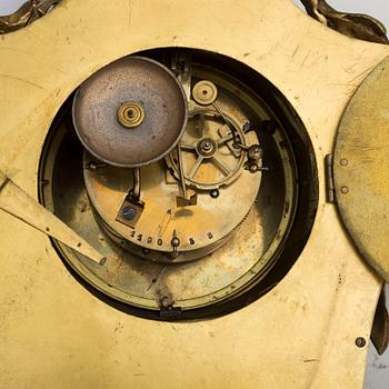 A brass wall clock marked A.W. Bruuns eftr, Lund from around year 1900.
