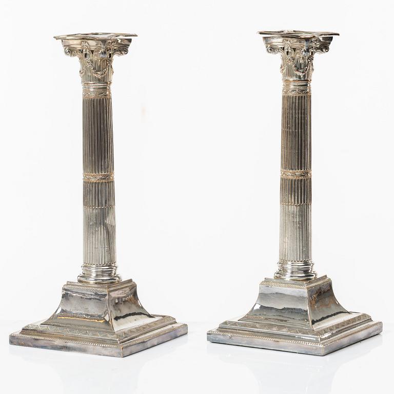 Four silver plated candlesticks, early 20th century.