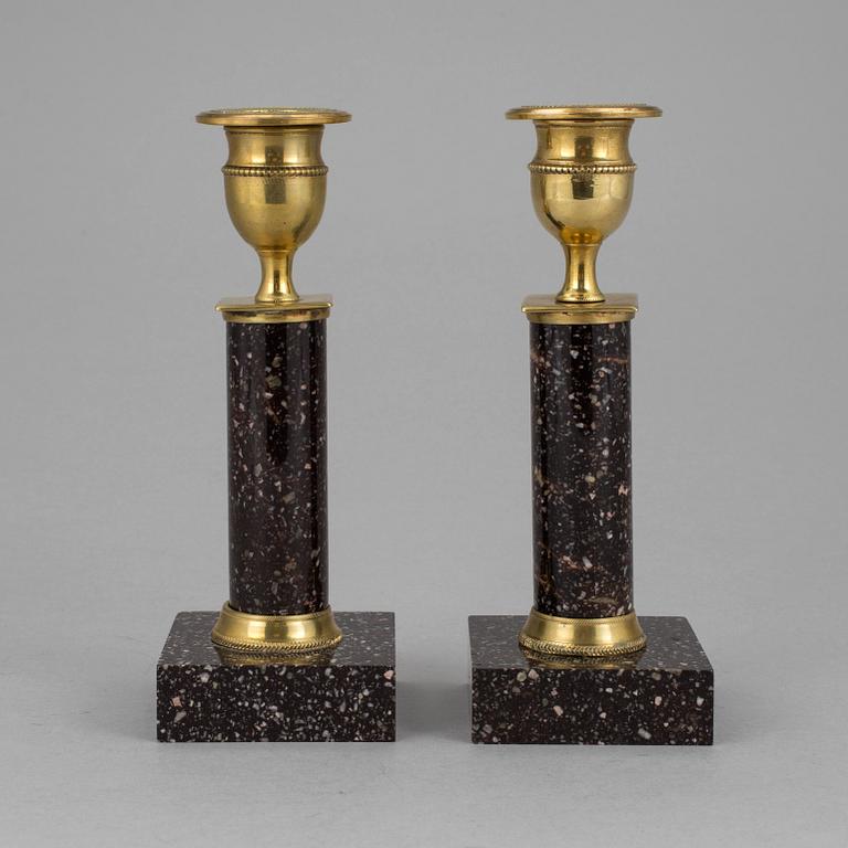 A pair of late gustavian porphyry candle sticks early 19th century.