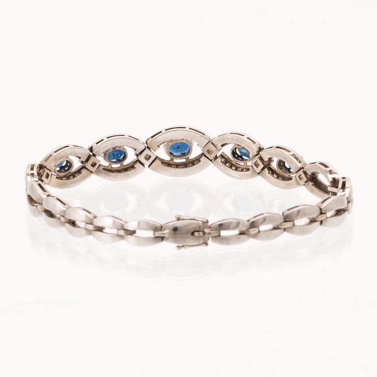 An 18K white gold bracelet set with oval faceted sapphires and brilliant-cut diamonds, Stockholm.