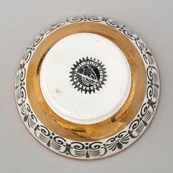 PIERO FORNASETTI, a set of 4 porcelain plates and 6 bowls, Milan, Italy.