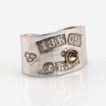 A pair earrings in 18K white gold set with round and oval brilliant-cut diamonds.