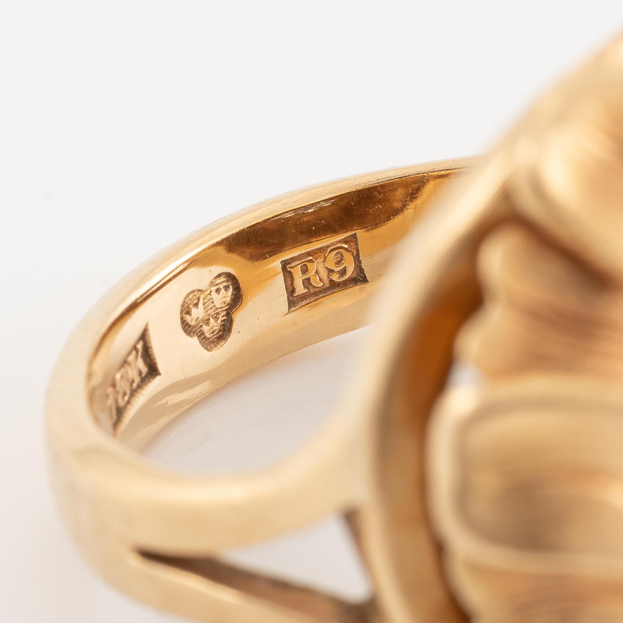 Ring, Hans Scherlund, 18K gold with white and blue stones.