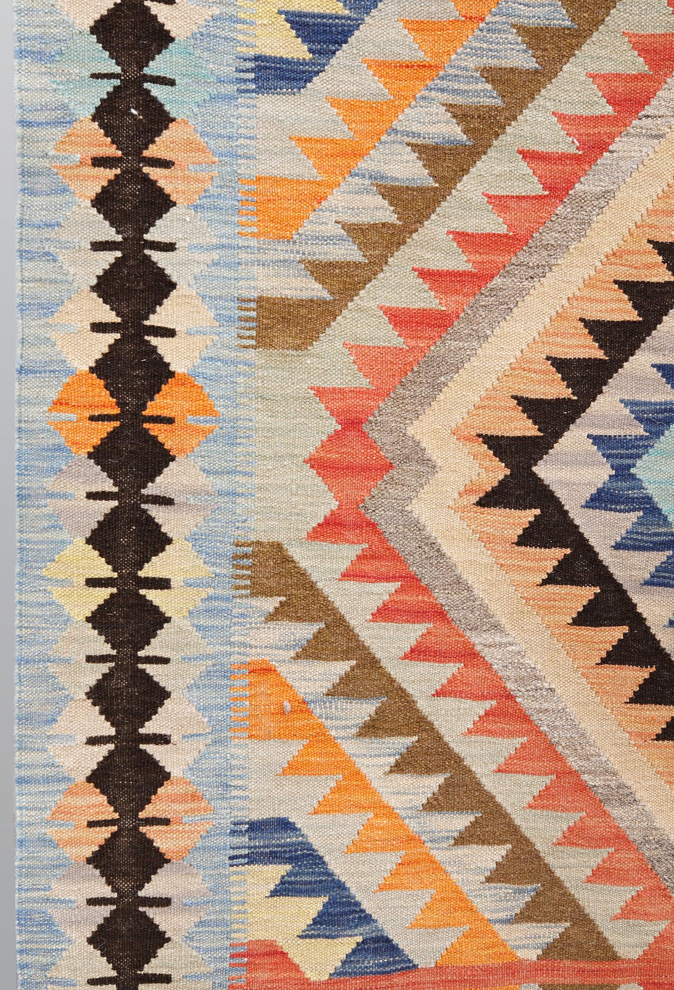 A kilim carpet, ca 386 x 151 cm.