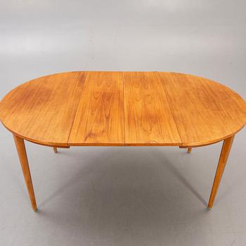 A 1960s teak dining table.