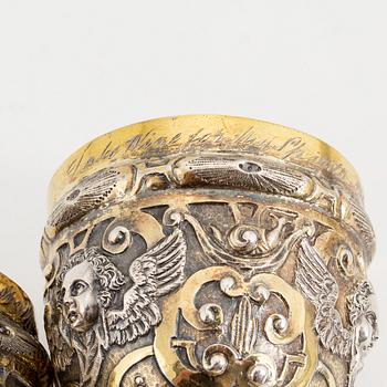 A pair of probably 19th Century parcel-gilt silver cups. Renaissance style.