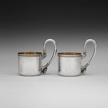 602. A pair of Russian 20th century parcel-gilt tea-glas holders, marks possibly of Vasily Andreyev, Moscow 1908-1917.