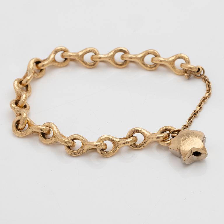 Armband 18K guld med en diamant.
