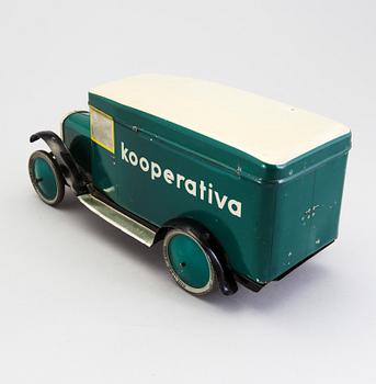 A tinplate biscuit jar in the shape of a truck 1930s.