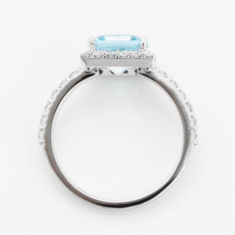 Blue topaz and brilliant-cut diamond ring.